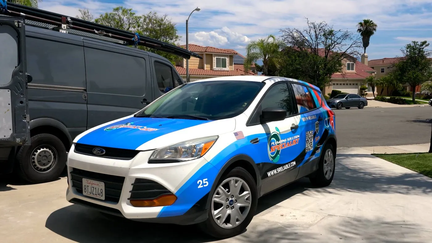 Plumbing Solution Specialist branded service car